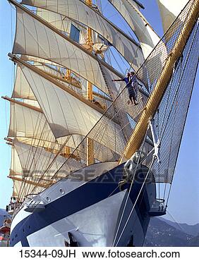 Stock Photo - prime couple standing 
on widow's net 
of clipper ship 
as it sails in. 
fotosearch - search 
stock photos, 
pictures, images, 
and photo clipart