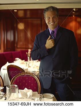 Stock Photo - prime businessman 
standing in restaurant. 
fotosearch - search 
stock photos, 
pictures, images, 
and photo clipart