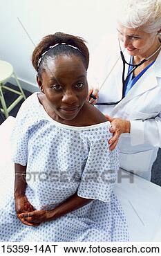 Stock Photo - mature female 
doctor examining 
pregnant middle-aged 
woman,  listening. 
fotosearch - search 
stock photos, 
pictures, images, 
and photo clipart