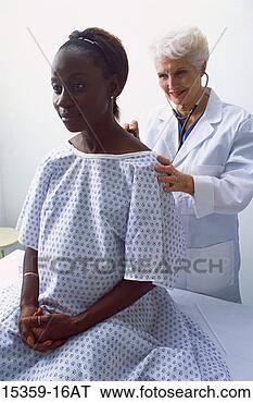Stock Photo - mature female 
doctor examining 
pregnant middle-aged 
woman,  listening. 
fotosearch - search 
stock photos, 
pictures, images, 
and photo clipart