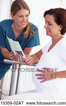 Stock Photo - middle-aged pregnant 
hispanic woman 
having discussion 
with young. fotosearch 
- search stock 
photos, pictures, 
images, and photo 
clipart