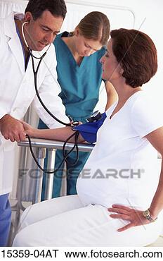Stock Photo - middle-aged pregnant 
hispanic woman 
having discussion 
with. fotosearch 
- search stock 
photos, pictures, 
images, and photo 
clipart