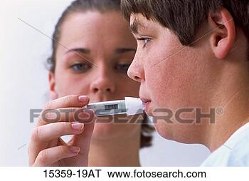 Stock Photo - pediatric female 
nurse taking teenage 
boy's temperature 
with digital. 
fotosearch - search 
stock photos, 
pictures, images, 
and photo clipart