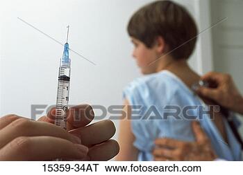 Stock Photo - pediatric female 
nurse's hand preparing 
syringe for injection 
while. fotosearch 
- search stock 
photos, pictures, 
images, and photo 
clipart