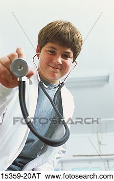 Stock Photo - teenage boy pretending 
to be a doctor, 
 wearing a lab 
coat and. fotosearch 
- search stock 
photos, pictures, 
images, and photo 
clipart