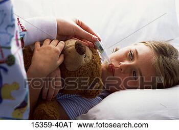 Stock Photo - young girl clutching 
stuffed bear while 
nurse takes her 
temperature. fotosearch 
- search stock 
photos, pictures, 
images, and photo 
clipart