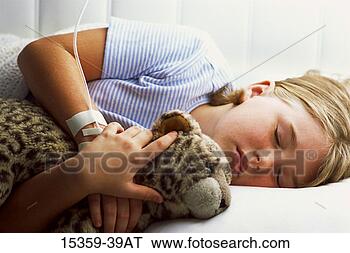 Stock Photo - young girl with 
intravenous tube 
in her arm,  sleeping 
as she. fotosearch 
- search stock 
photos, pictures, 
images, and photo 
clipart
