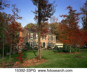 Stock Photo - exterior of colonial 
style house in 
fall. fotosearch 
- search stock 
photos, pictures, 
images, and photo 
clipart