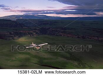 Stock Photo - piper cub airplane 
in flight. fotosearch 
- search stock 
photos, pictures, 
images, and photo 
clipart