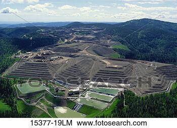 Stock Photo - gold mine with 
cyanide leach 
piles and ponds, 
 black hills, 
 south. fotosearch 
- search stock 
photos, pictures, 
images, and photo 
clipart