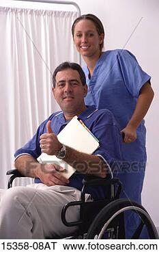 Stock Photo - female nurse standing 
behind middle-aged 
man in wheelchair 
as he. fotosearch 
- search stock 
photos, pictures, 
images, and photo 
clipart