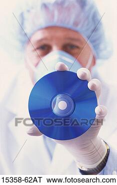 Stock Photo - mature male laboratory 
technician wearing 
face mask,  latex 
gloves. fotosearch 
- search stock 
photos, pictures, 
images, and photo 
clipart