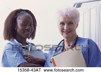 Stock Photo - middle-aged female 
(age 35) doctor/nurse 
and mature female. 
fotosearch - search 
stock photos, 
pictures, images, 
and photo clipart