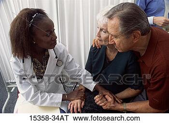 Stock Photo - middle-aged female 
doctor giving 
bad news to mature 
couple. fotosearch 
- search stock 
photos, pictures, 
images, and photo 
clipart