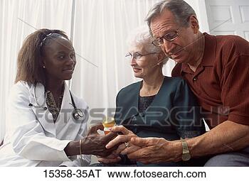 Stock Photo - middle-aged female 
doctor discussing 
prescription medication 
with. fotosearch 
- search stock 
photos, pictures, 
images, and photo 
clipart