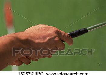 Stock Photo - close-up of male 
golfer's ungloved 
hands gripping 
handle of golf 
club. fotosearch 
- search stock 
photos, pictures, 
images, and photo 
clipart