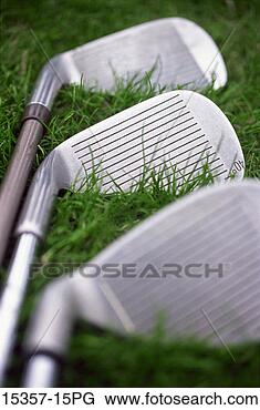 Stock Photo - three golf irons 
lined up on grass, 
property released 
golf course. fotosearch 
- search stock 
photos, pictures, 
images, and photo 
clipart