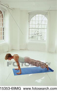 Stock Photo - young woman in 
yoga posture, 
plank posture. 
fotosearch - search 
stock photos, 
pictures, images, 
and photo clipart