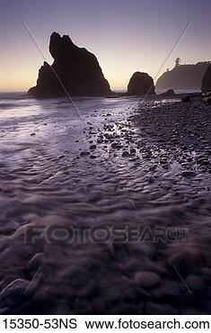 Stock Photo - rock formation 
along shore and 
ground-level view 
of ocean tide, 
 ruby. fotosearch 
- search stock 
photos, pictures, 
images, and photo 
clipart