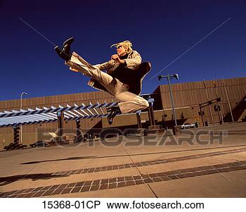 Stock Photo - businesswoman 
leaping for joy 
in parking lot. 
fotosearch - search 
stock photos, 
pictures, images, 
and photo clipart