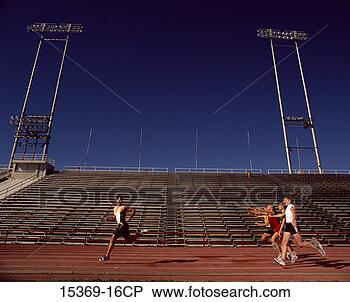 Stock Photo - group of young 
women chasing 
male racer on 
track. fotosearch 
- search stock 
photos, pictures, 
images, and photo 
clipart
