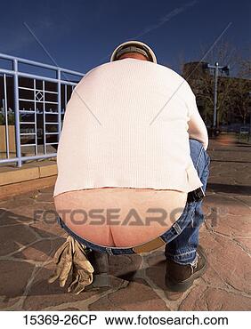 Stock Photo - rear view of construction  worker bending  over revealing  his butt crack.  fotosearch - search  stock photos,  pictures, images,  and photo clipart