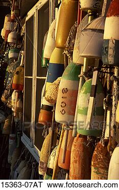 Stock Photo - lobster trap floats 
hanging on exterior 
of building, new 
england, usa. 
fotosearch - search 
stock photos, 
pictures, images, 
and photo clipart