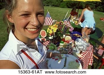 Stock Photo - teenage girl at 
july 4th backyard 
picnic, new england, 
usa. fotosearch 
- search stock 
photos, pictures, 
images, and photo 
clipart