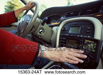 Stock Photo - woman's hand adjusting 
gps (global positioning 
system) as she 
drives. fotosearch 
- search stock 
photos, pictures, 
images, and photo 
clipart
