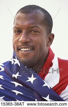 Stock Photo - middle-aged man 
wrapped in american 
flag, headshot. 
fotosearch - search 
stock photos, 
pictures, images, 
and photo clipart