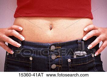 Stock Photo - young woman's 
waist,  in hip-hugger 
jeans,  with pierced 
naval and. fotosearch 
- search stock 
photos, pictures, 
images, and photo 
clipart