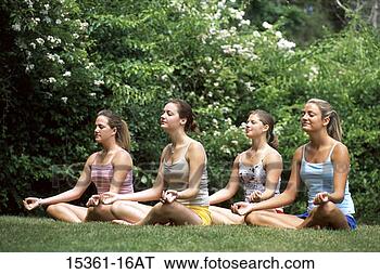 Stock Photo - four teenage girls 
in yoga meditation 
posture on lawn. 
fotosearch - search 
stock photos, 
pictures, images, 
and photo clipart