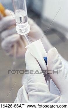 Stock Photo - gloved hand adjusting 
intravenous fluid 
drip. fotosearch 
- search stock 
photos, pictures, 
images, and photo 
clipart