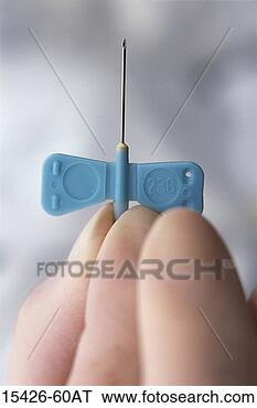 Stock Photo - gloved hand holding 
butterfly intravenous 
needle. fotosearch 
- search stock 
photos, pictures, 
images, and photo 
clipart