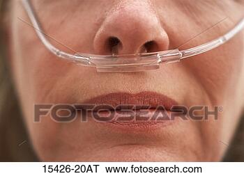 Stock Photo - woman wearing 
oxygen nasal cannula 
in her nose. fotosearch 
- search stock 
photos, pictures, 
images, and photo 
clipart