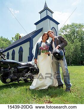 Stock Photo - biker bride and 
groom in front 
of church. fotosearch 
- search stock 
photos, pictures, 
images, and photo 
clipart