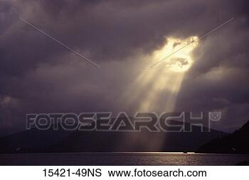 Stock Photo - sun rays through 
clouds, queen 
charlotte islands, 
british columbia. 
fotosearch - search 
stock photos, 
pictures, images, 
and photo clipart