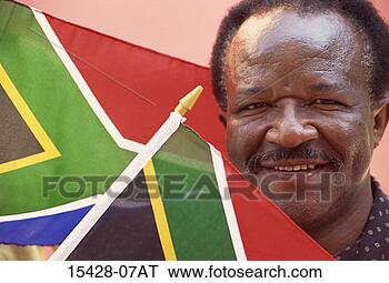 Stock Photo - man (50s) with 
flags of south 
africa. fotosearch 
- search stock 
photos, pictures, 
images, and photo 
clipart