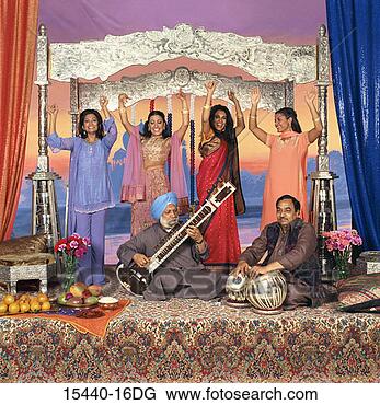 Stock Photo - four women dancing 
behind man playing 
sitar and man 
playing drums. 
fotosearch - search 
stock photos, 
pictures, images, 
and photo clipart