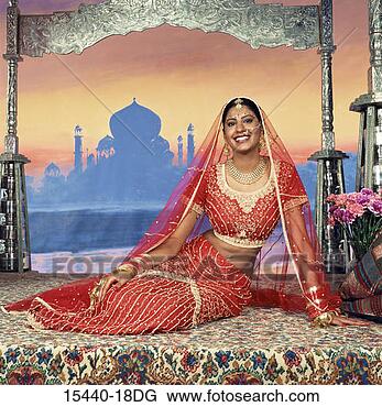 Stock Photo - woman in indian 
wedding dress, 
 sitting on floor 
in front of taj. 
fotosearch - search 
stock photos, 
pictures, images, 
and photo clipart