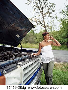 Stock Photo - woman with car 
trouble on cellphone. 
fotosearch - search 
stock photos, 
pictures, images, 
and photo clipart