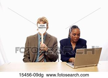 Stock Photo - businessman and 
businesswoman, 
 man holding mask 
that says,  'your. 
fotosearch - search 
stock photos, 
pictures, images, 
and photo clipart