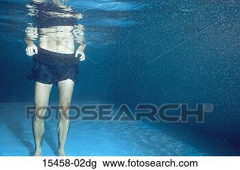 Stock Photo - man standing in 
pool, underwater 
view. fotosearch 
- search stock 
photos, pictures, 
images, and photo 
clipart