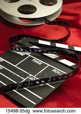 Stock Photo - movie set clapboard  and film reel.  fotosearch - search  stock photos,  pictures, wall  murals, images,  and photo clipart