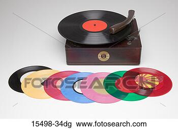 Stock Photo - record on antique 
record player 
surrounded by 
multi-colored 
45s. fotosearch 
- search stock 
photos, pictures, 
images, and photo 
clipart