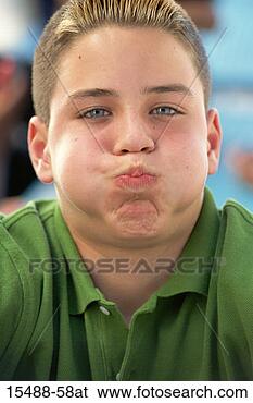 Stock Photo - teen boy puffing 
out cheeks. fotosearch 
- search stock 
photos, pictures, 
images, and photo 
clipart