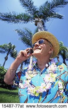 Stock Photo - mature man on 
cell phone in 
a tropical environment. 
fotosearch - search 
stock photos, 
pictures, images, 
and photo clipart