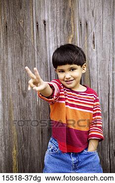 Stock Photo - boy making a peace 
sign gesture. 
fotosearch - search 
stock photos, 
pictures, images, 
and photo clipart