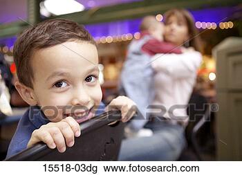 Stock Photo - boy with people 
in background. 
fotosearch - search 
stock photos, 
pictures, images, 
and photo clipart