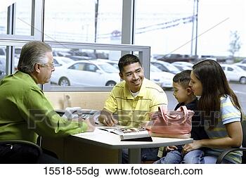 Stock Photo - young family negotiating 
car deal. fotosearch 
- search stock 
photos, pictures, 
images, and photo 
clipart